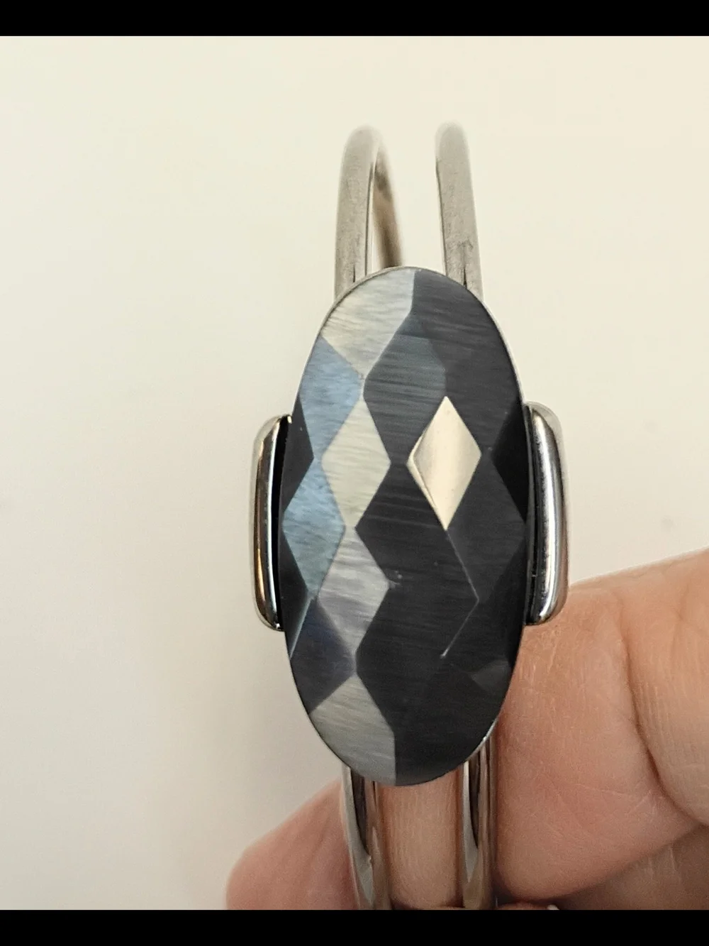 Silver-Tone Bracelet with Faceted Black Oval Center